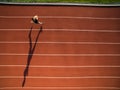 Sprinter running on athletics tracks seen from above Royalty Free Stock Photo