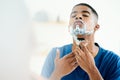 Have to make sure I shave properly this time. Shot of young man focusing on shaving throughly. Royalty Free Stock Photo