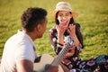 I saw that you were perfect, and so I loved you. Shot of a young man playing a guitar while on a picnic with his Royalty Free Stock Photo