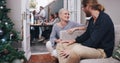 Are you enjoying the party. Shot of a young man and woman chatting at a dinner party with their friends. Royalty Free Stock Photo