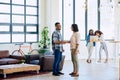 Partner up and go further. Shot of a young man and woman shaking hands in a modern office. Royalty Free Stock Photo