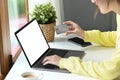 Shot of young woman holding credit card and using computer laptop for payment online or shopping online Royalty Free Stock Photo