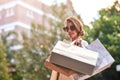 Im gonna look so fabulous in these. Shot of a young woman out shopping in the city.