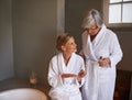 Getting the bride ready for her big day. Shot of a young woman painting her nails while her grandmother stands by. Royalty Free Stock Photo