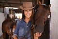A girls best friend. Shot of a young woman tending to her horse. Royalty Free Stock Photo