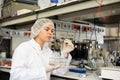 Shot of an young woman using equipment to work in a laboratory Royalty Free Stock Photo