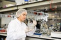 Shot of an young woman using equipment to work in a laboratory Royalty Free Stock Photo