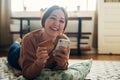 My heart and shopping cart is overflowing with happiness. Shot of a young woman using a smartphone and credit card at