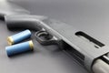 A Shotgun with Blue shotgun shells Royalty Free Stock Photo