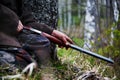 Shotgun close-up in the hands of a hunter sitting in wait. Waiting for game Royalty Free Stock Photo