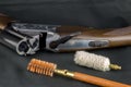 Shotgun and Gun Cleaning Items on a Baize Table Royalty Free Stock Photo