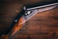 Shotgun on wooden background