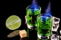 Shots of absinthe and sugar cubes isolated on black background. space for text Royalty Free Stock Photo