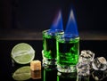 Shots of absinthe and sugar cubes isolated on black background. space for text Royalty Free Stock Photo