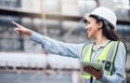 We should check that. a young female architect using a digital tablet at a building site. Royalty Free Stock Photo