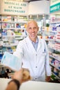 This should improve your health in no time. Personal perspective shot of a pharmacist handing over medication to a