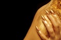 On the shoulder, fingers with golden manicure Royalty Free Stock Photo