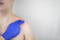 A man suffers from shoulder pain. Shoulder injury, tendonitis, sprain, or tendon inflammation. The concept of acute pain and