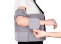 Shoulder Joint Brace. Orthopedic Arm Elbow Stabilizer with abduction pad. Bandage on the shoulder joint Royalty Free Stock Photo