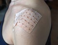 Shoulder with medical patch. Muscle sprains and pain. Royalty Free Stock Photo