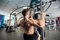 Shoulder pull down machine. Fitness man working out lat pulldown training at gym. Upper body strength exercise for the Royalty Free Stock Photo