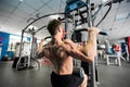 Shoulder pull down machine. Fitness man working out lat pulldown training at gym. Upper body strength exercise for the