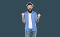 shouting bearded man with book on head on grey background Royalty Free Stock Photo