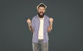 shouting bearded man with book on head on grey background Royalty Free Stock Photo