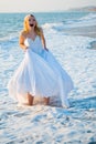 Shouting bride in sea spume