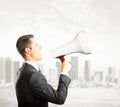 Shouting businessman with magaphone Royalty Free Stock Photo