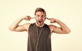 Shouting guy listening to music in stereo headset. mp3 player. sexy muscular man listen music on phone mp3 player. man Royalty Free Stock Photo