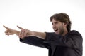 Shouting young man pointing sideways Royalty Free Stock Photo