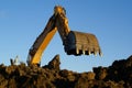 Shovel bucket against blue sky Royalty Free Stock Photo