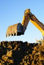 Shovel bucket against blue sky Royalty Free Stock Photo