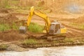 Shovel bucket on river bank , lift loads, construction machinery