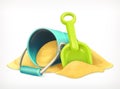 Shovel and bucket in the sand