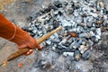 Shovel and burned cans and glass bottles.