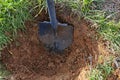 Shovel digs a hole for tree planting. Royalty Free Stock Photo