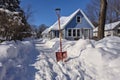 shovel on driveway with snow-cleared path