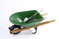 Shovel,Pick in green wheel barrel Royalty Free Stock Photo