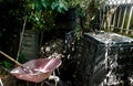 A shovel and pitchfork will be used to fill the wheelbarrow with compost