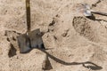 Shovel placed on sand for construction