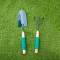 Shovel and rake on green grass Royalty Free Stock Photo