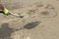 Shovel with sand. Throws sand with a shovel Royalty Free Stock Photo