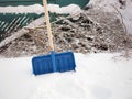 shovel in snow pile