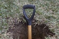 A shovel stuck in a hole Royalty Free Stock Photo