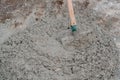 Shovel in wet concrete on the ground Royalty Free Stock Photo