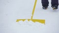 Shoveling snow shovel on the slopes