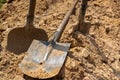 Shovels in the ground. Burial and burial concept. Ritual services, grave digging Royalty Free Stock Photo