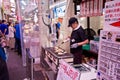 show cooking in a food market in japan